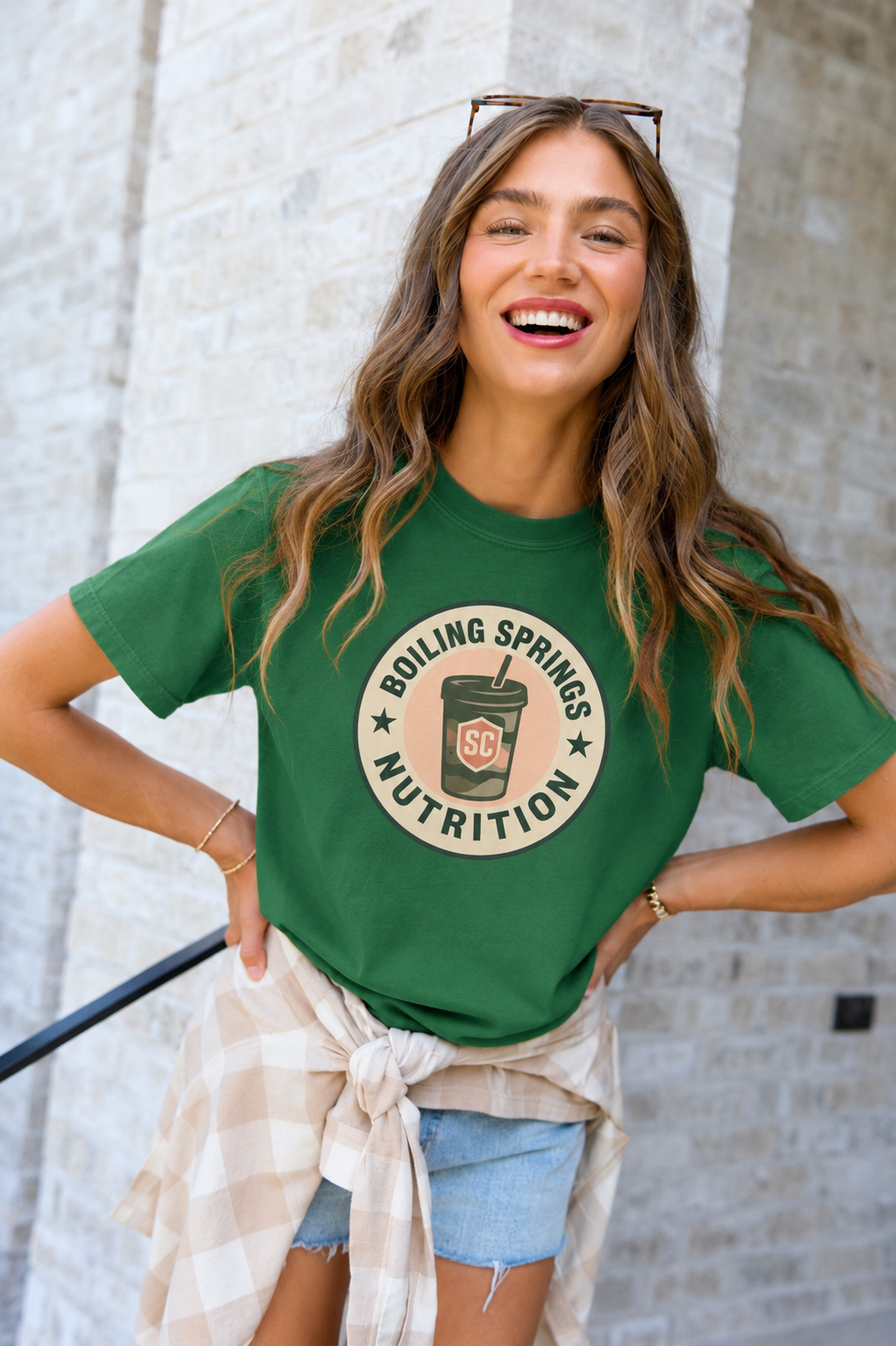 Woman wearing the green Boiling Springs Nutrition logo tee