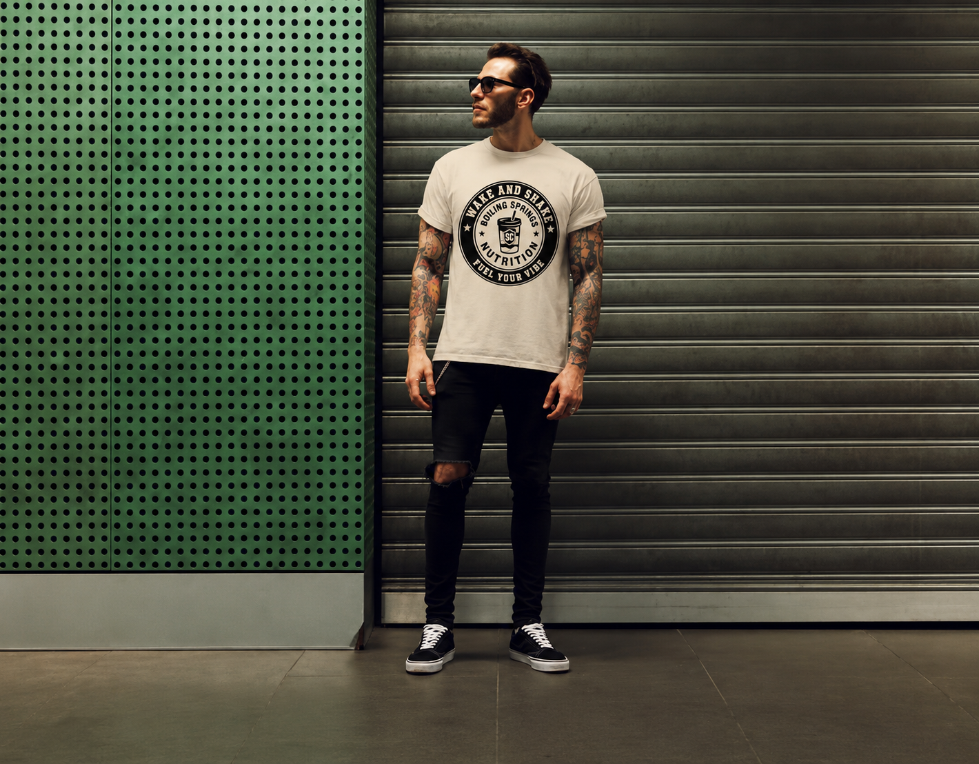Man wearing a white Wake and Shake BSN tee