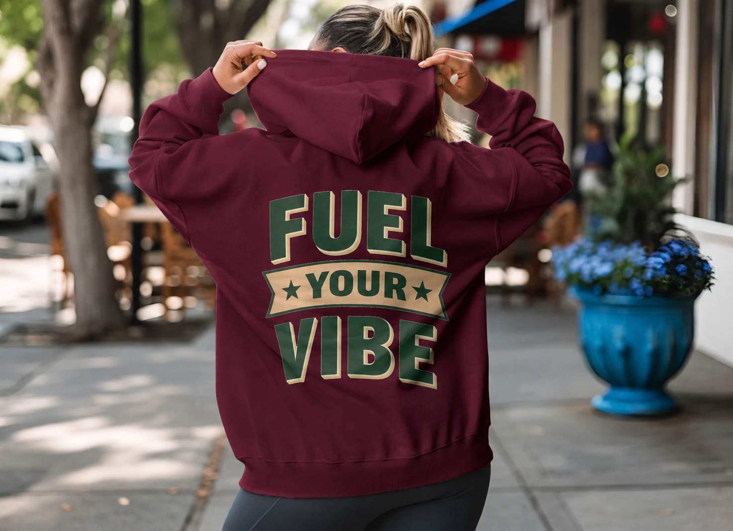 Fuel Your Vibe maroon BSN hoodie worn on a Boiling Springs sidewalk